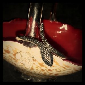 Silver might be sterling  snake bangle